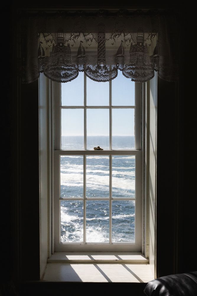 View of the ocean from a window in Battery Point Lighthouse