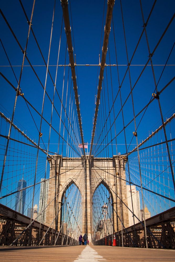 Visitors strolling on the Brooklyn Bridge