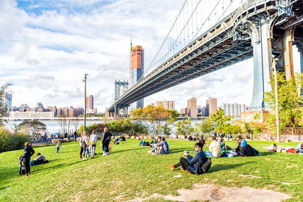 People relaxing on the lawn at Brooklyn Bridge Park
