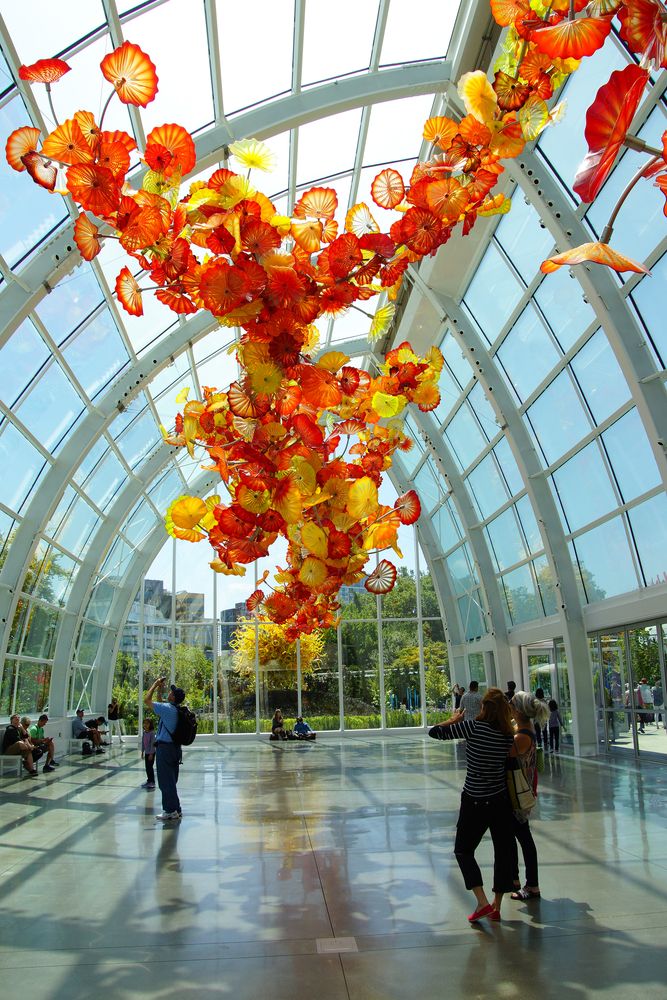 Visitors enjoying the art at Chihuly Garden and Glass