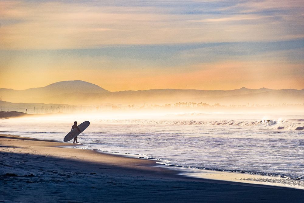 Surfer getting into the Coronado Beach