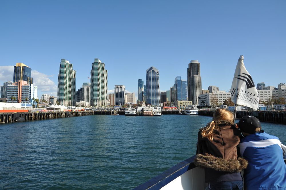 A young couple enjoying the view of the city from Coronado Ferry