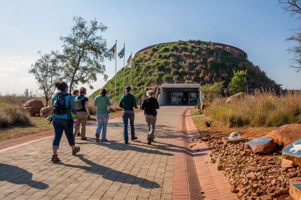 Young women walking towards the Cradle of Humankind