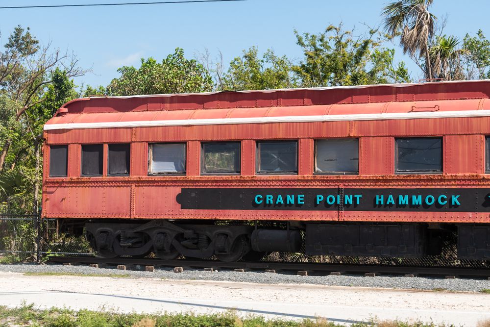 Name board of Crane Point Hammock on a abandoned train