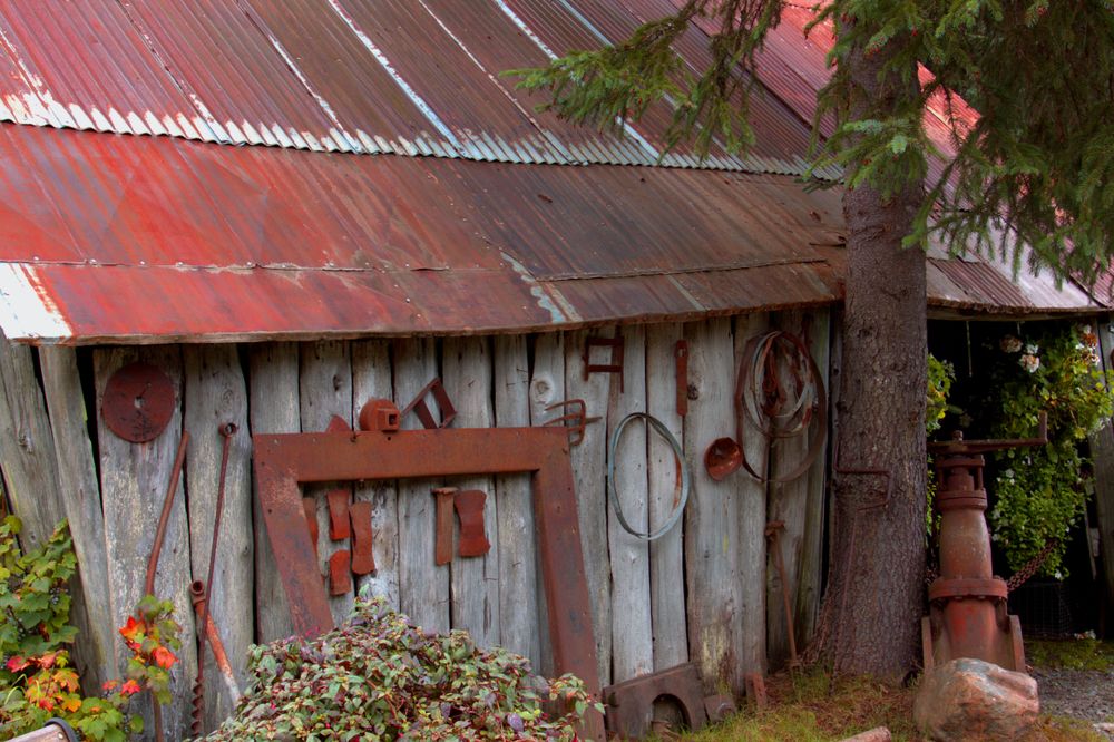 Old rusted tools hanging on a shack at Crow Creek Mine