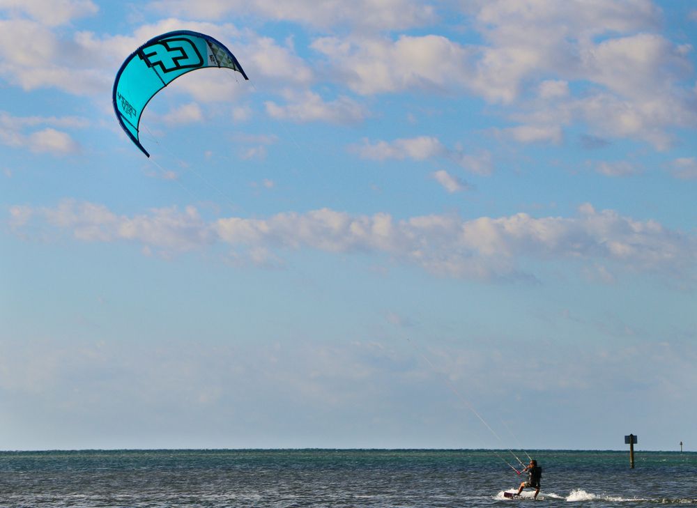 A man enjoying kite surfing at Curry Hammock State Park