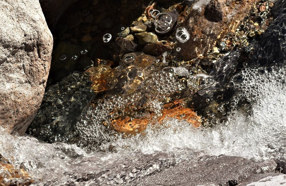 Close up of water crashing on the rocks at Dripping Springs Natural Area