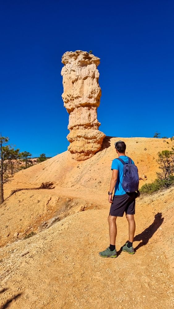 A man hiking through the Fairyland Loop Trail