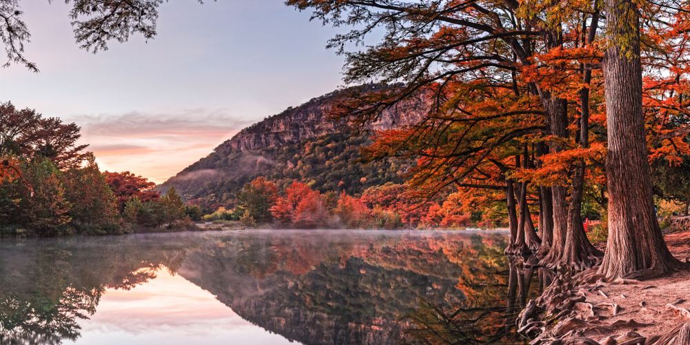 Colorful sunrise reflecting on Frio River.