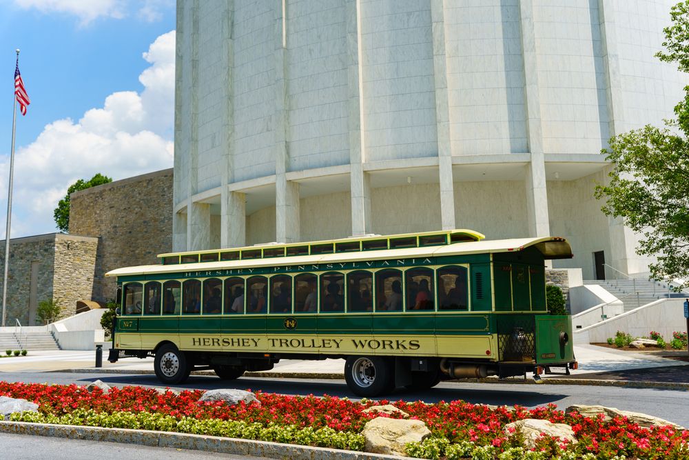 Tourists riding the Hershey Trolley along the Hershey school