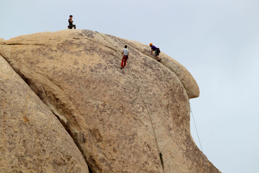 People climbing the rock in Hidden Valley Campground
