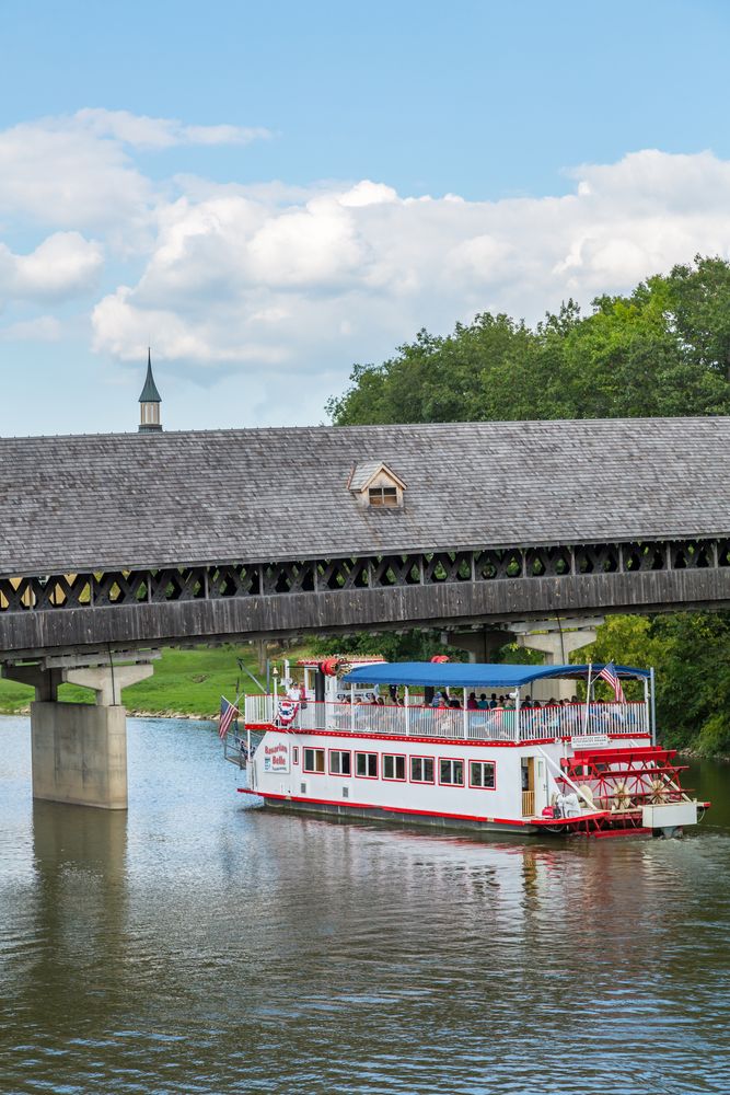 Boat passing beneath the Holz-Brucke Wooden Bridge