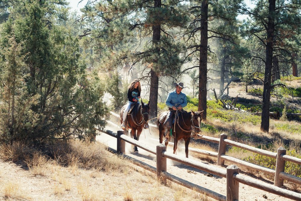 A couple riding on the horse at Bryce Canyon National Park