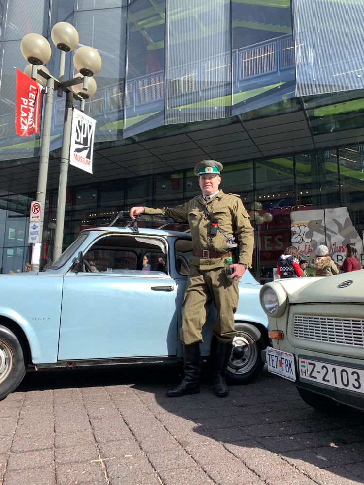 A man posing infront of the International Spy Museum