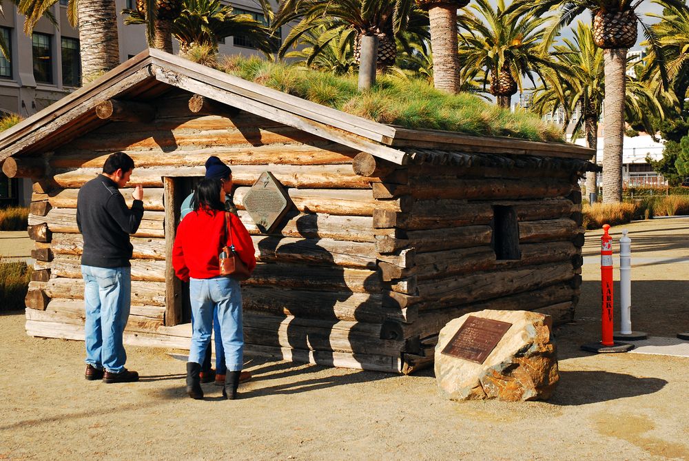 Visitors exploring the Jack London Cabin