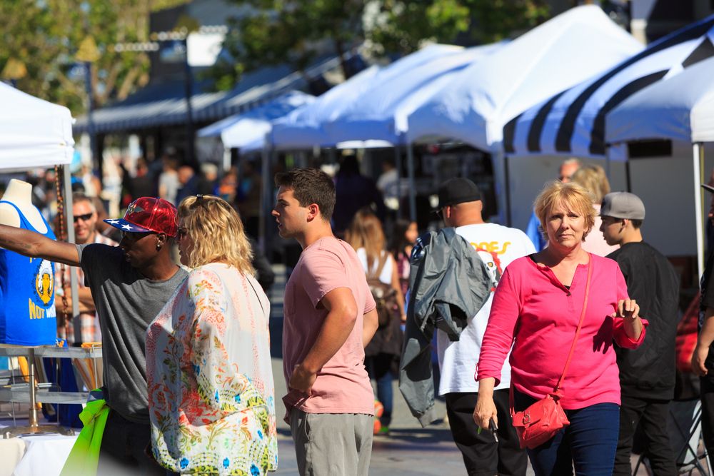 Visitors strolling around the Jack London Square Farmers’ Market