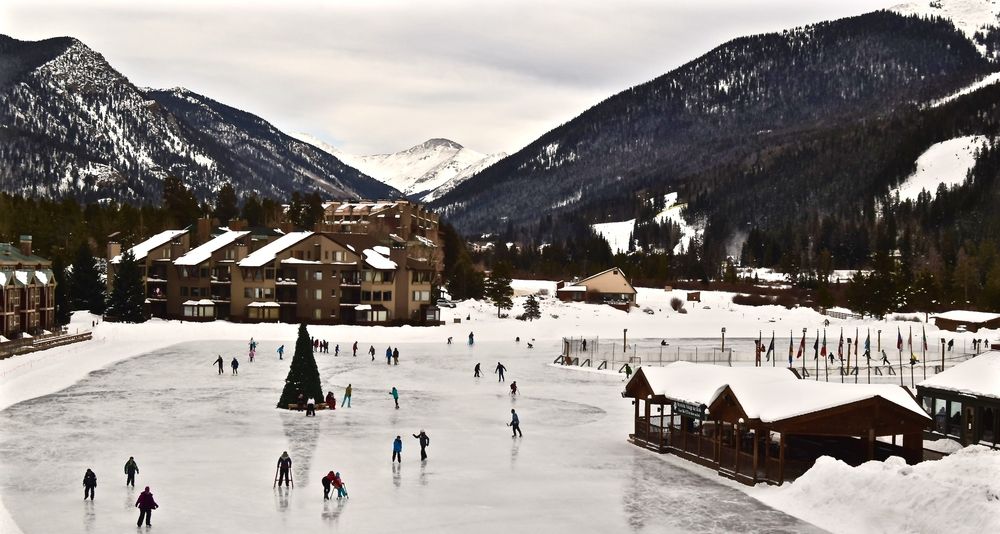 People ice skating on the frozen Keystone Lake