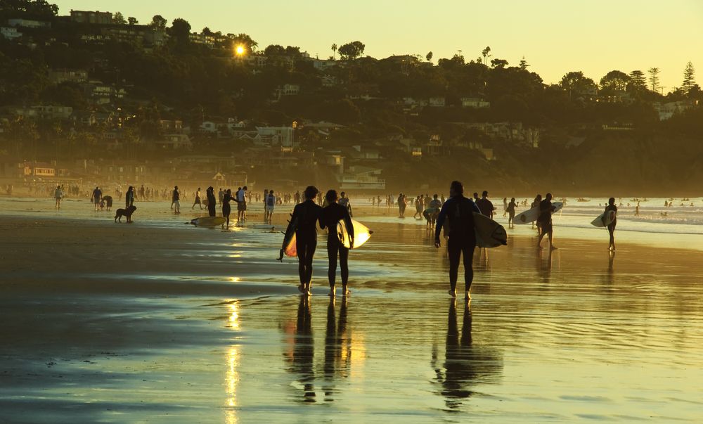 Surfers getting ready to get into the water at La Jolla
