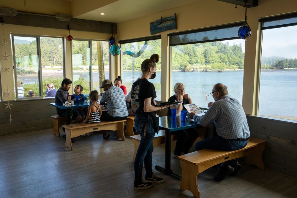 People enjoying seafood at a restaurant in Lincoln City