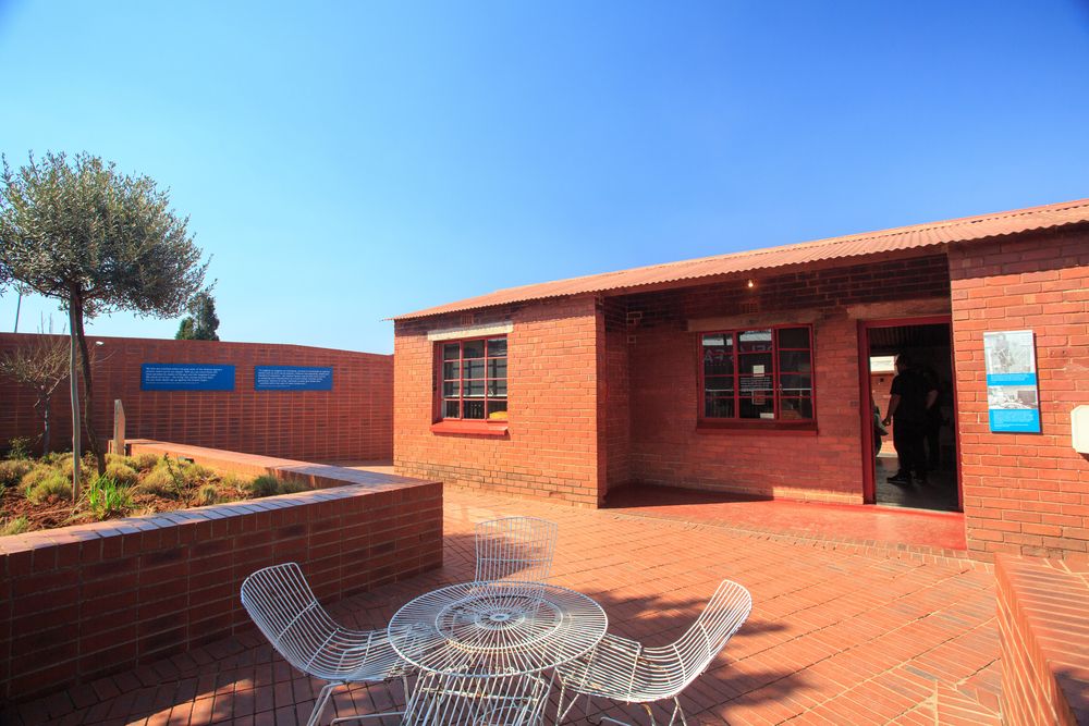 Front view of the red bricked building of Mandela House