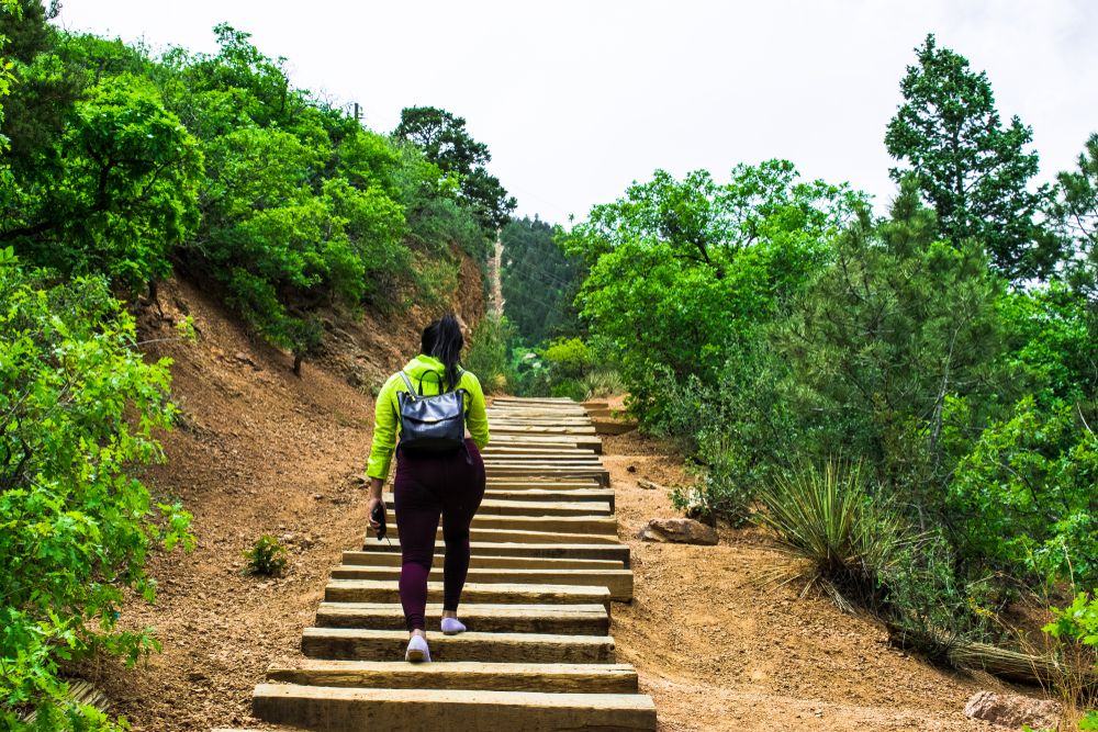 A female hiker climbing the Manitou Springs Incline