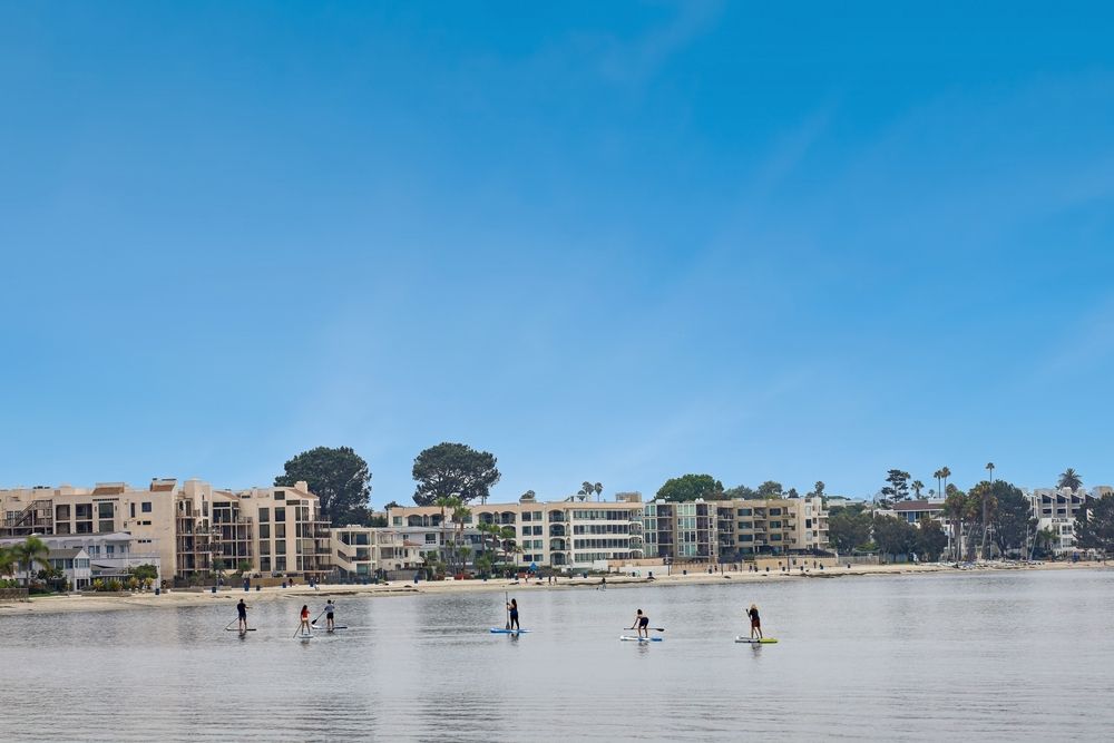 People enjoying Stand Up Paddle boarding at Mission Bay