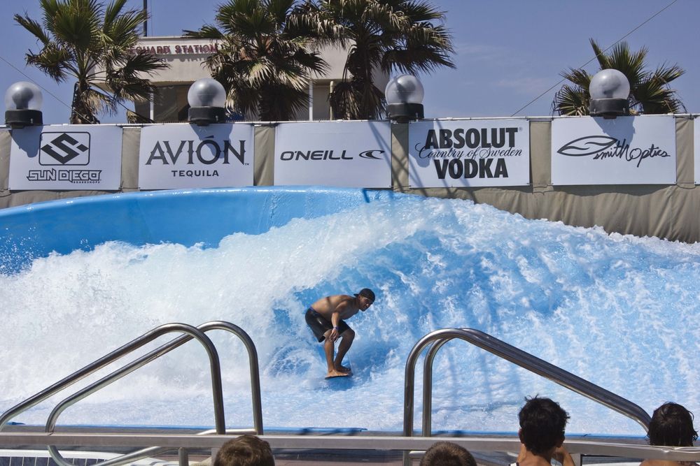 A person surfing on the wave house pool of Mission Beach