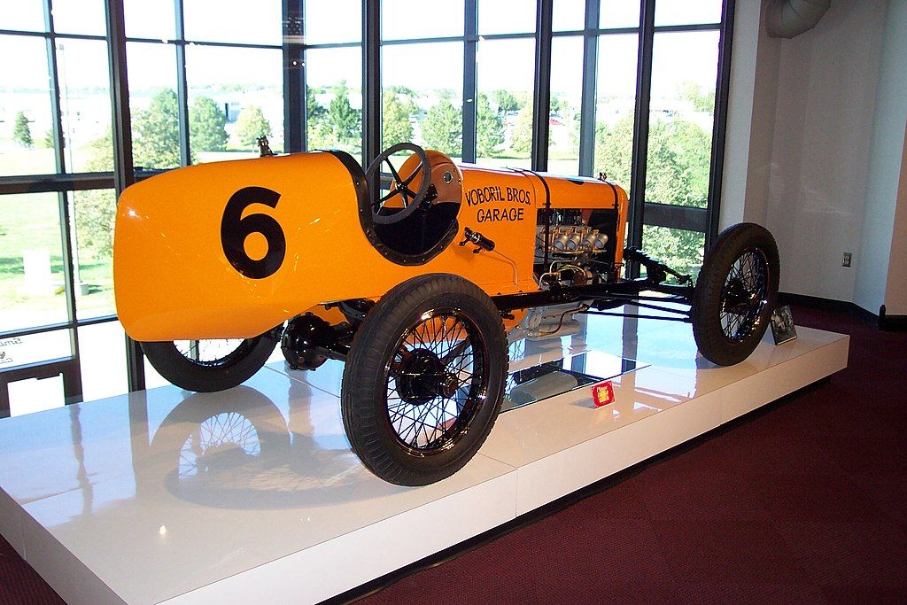 Display of an yellow vehicle at Museum of American Speed