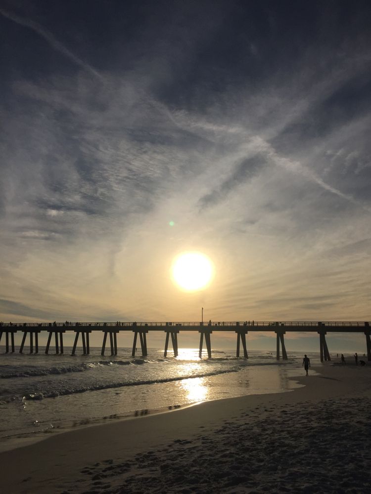 Sun shining brightly over the Navarre Beach Fishing Pier