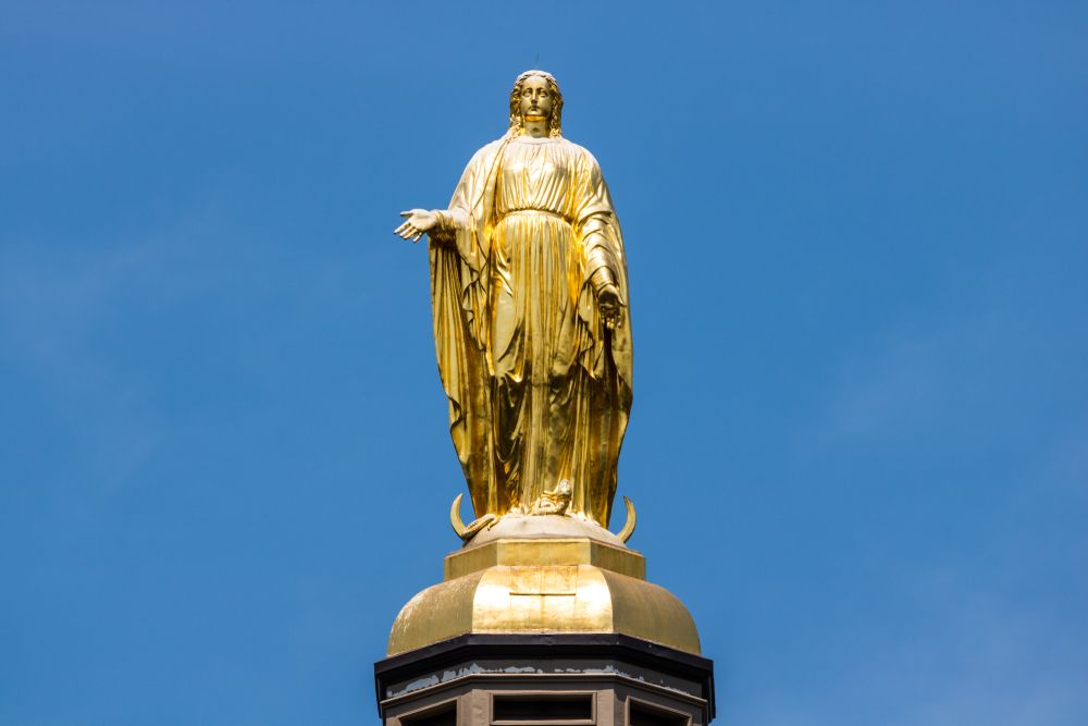 Golden statue of virgin mary at Notre Dame Golden Dome