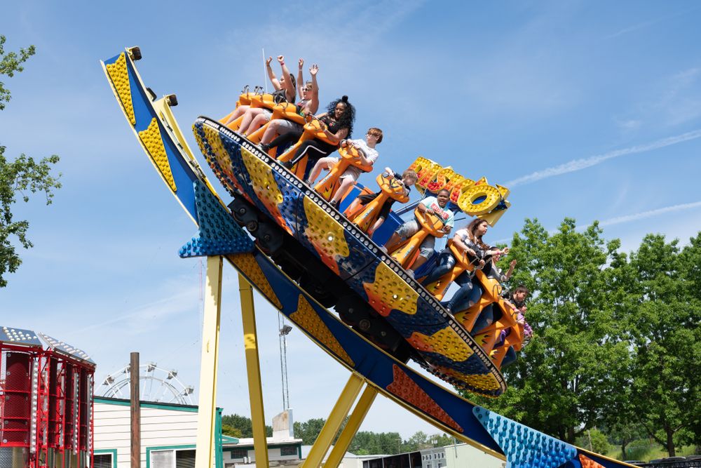 People enjoying a ride at Oaks Amusement Park
