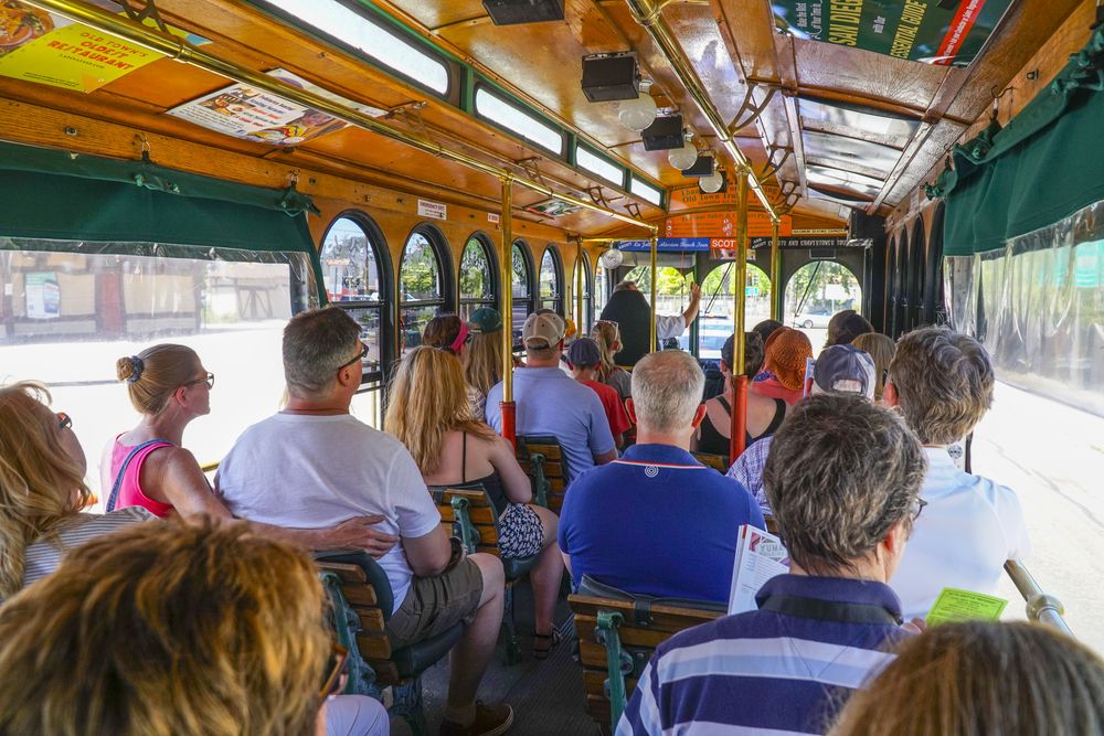 Tourists seated inside the Old Town Trolley