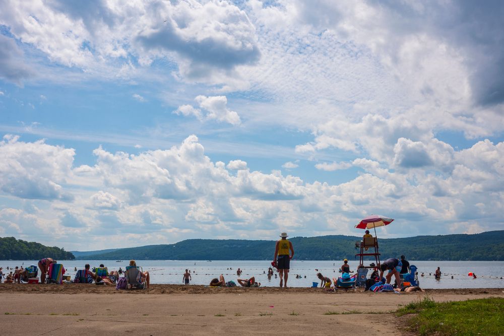 People relaxing at Otsego Lake
