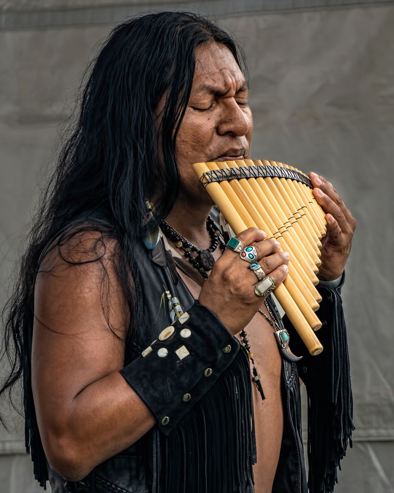 A native american playing flute at Queens County Farm Museum