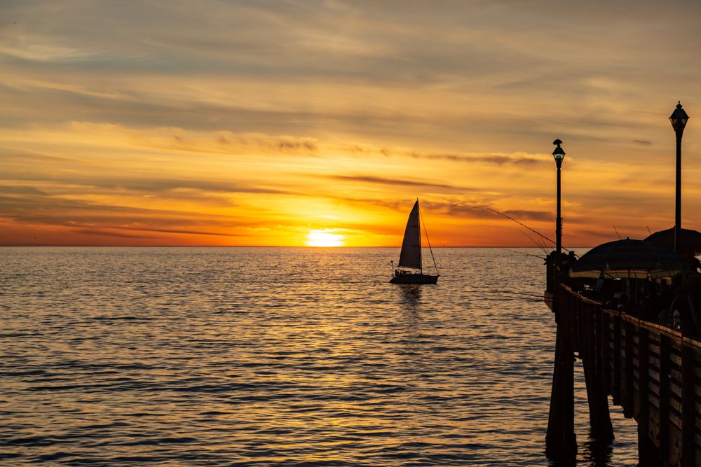 A lonely boat sailing at Redondo Beach
