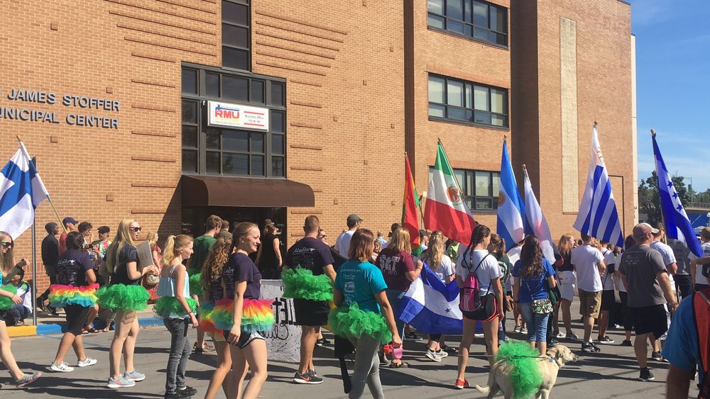 People walking along Downtown Rolla during a national parade