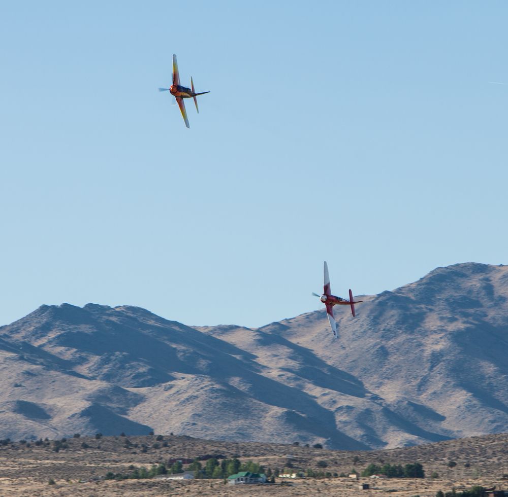 Aircraft flying over a valley during STIHL National Championship Air Races