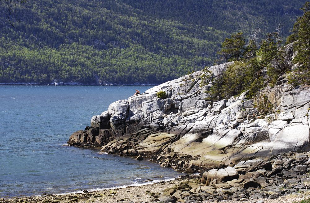 Scenic view of a cliff and body of water