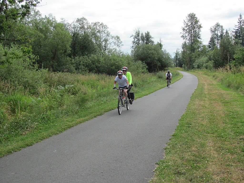 People cycling in Snohomish County Centennial Trail