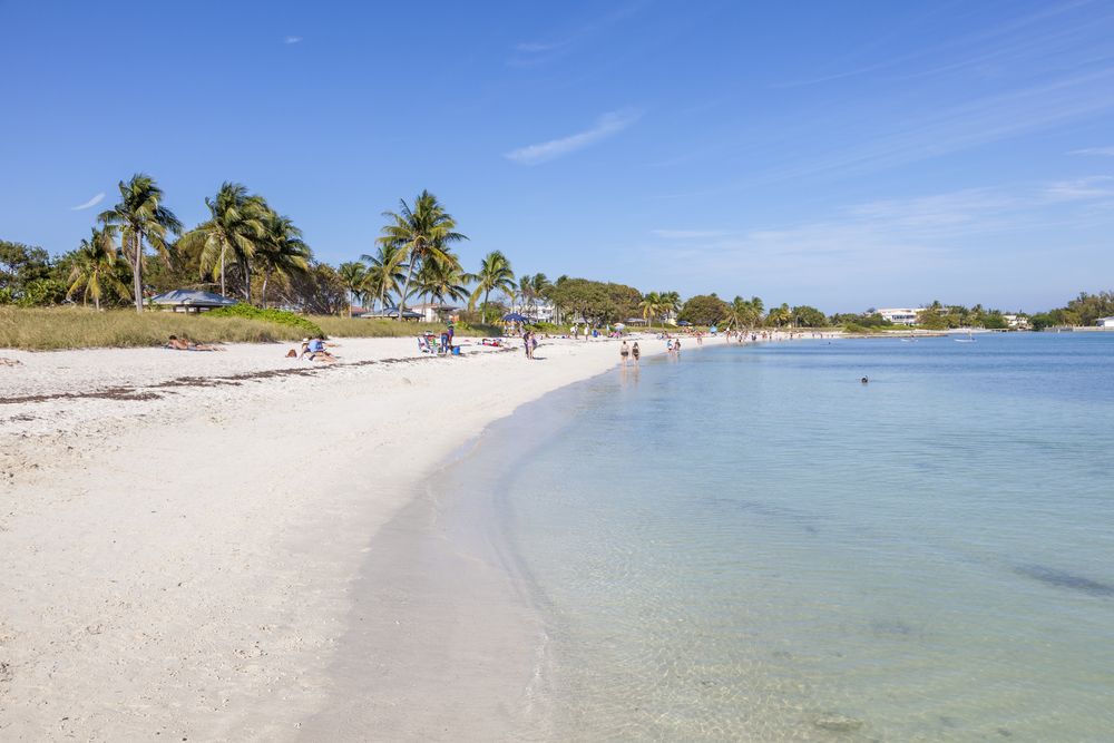 People enjoying in Sombrero Beach on a sunny day