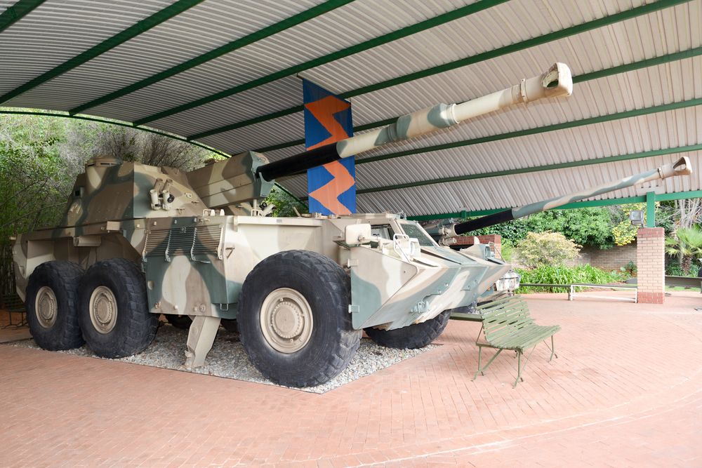 Militiary vehicle with a bench in front kept for display at South African Museum of Military History