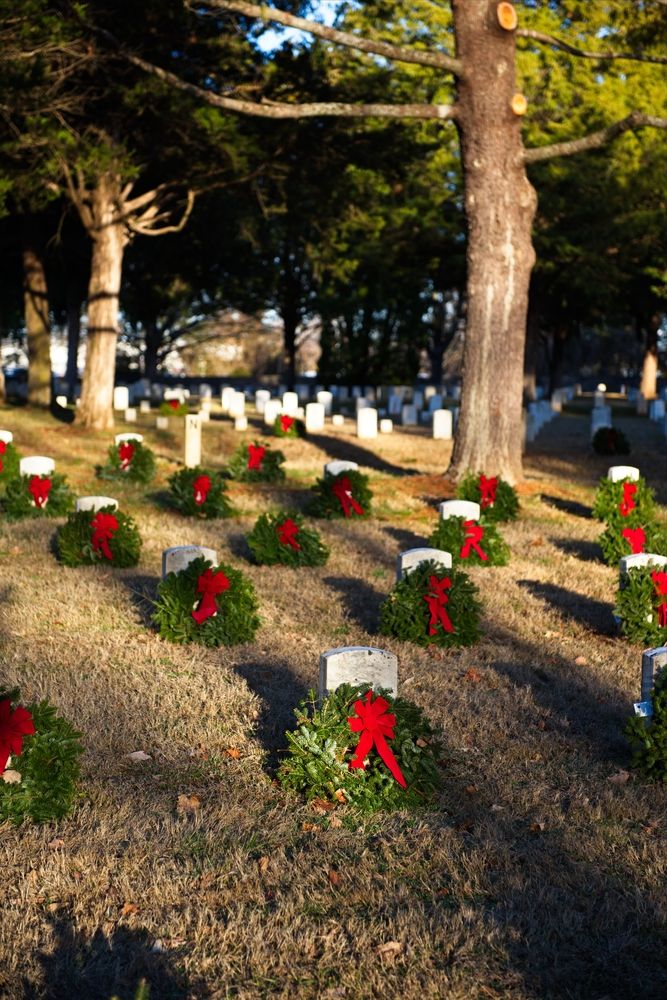 Tomb stones decorated with wreath and ribbon at Stones River National Cemetery