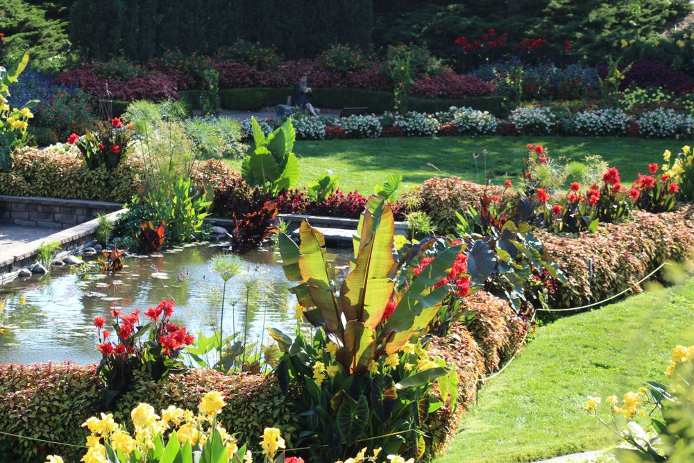 Colorful flowers and artificial pond at Sunken Garden
