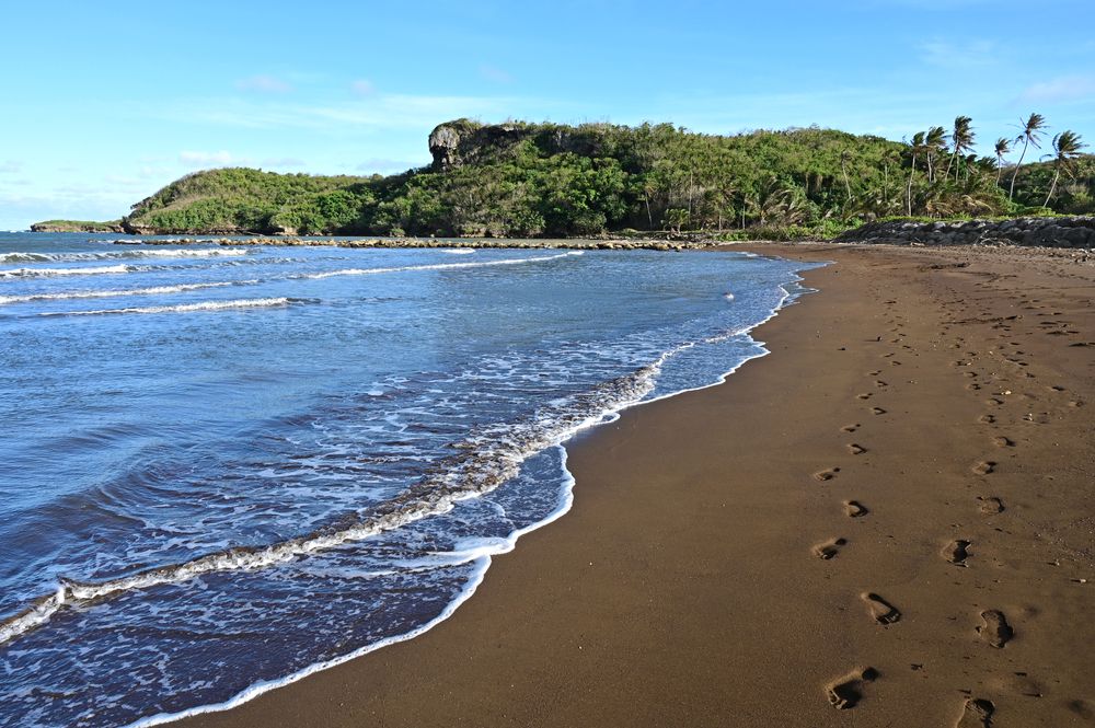 Footsteps on the sand of Talofofo beach