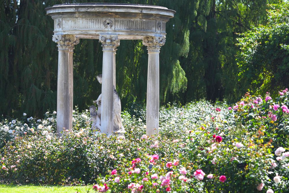 Statue surrounded by colorful flowers at The Huntington Library, Art Museum, and Botanical Gardens