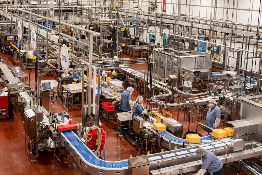 Employees working on the meachinaries at Tillamook Creamery Factory