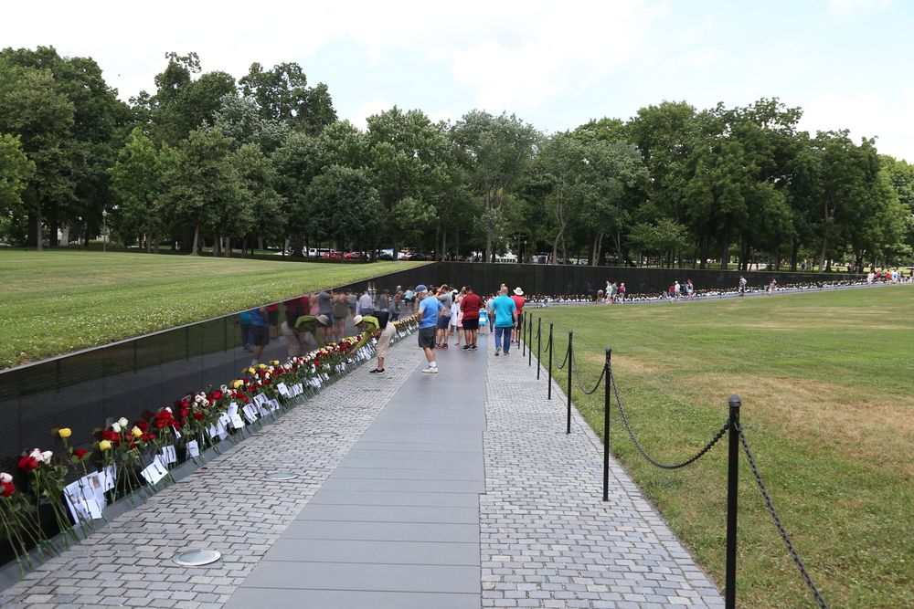 People paying respect at Vietnam Veterans Memorial