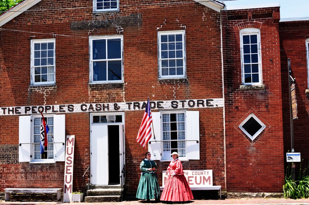 Two women wearing vintage dress and waiting outside the Virginia Randolph Museum