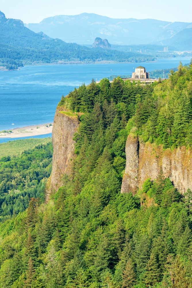 A distant view of the Vista House at Crown Point