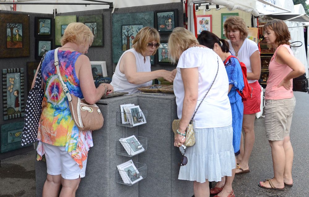 People shopping at the Ann Arbor Art Fair